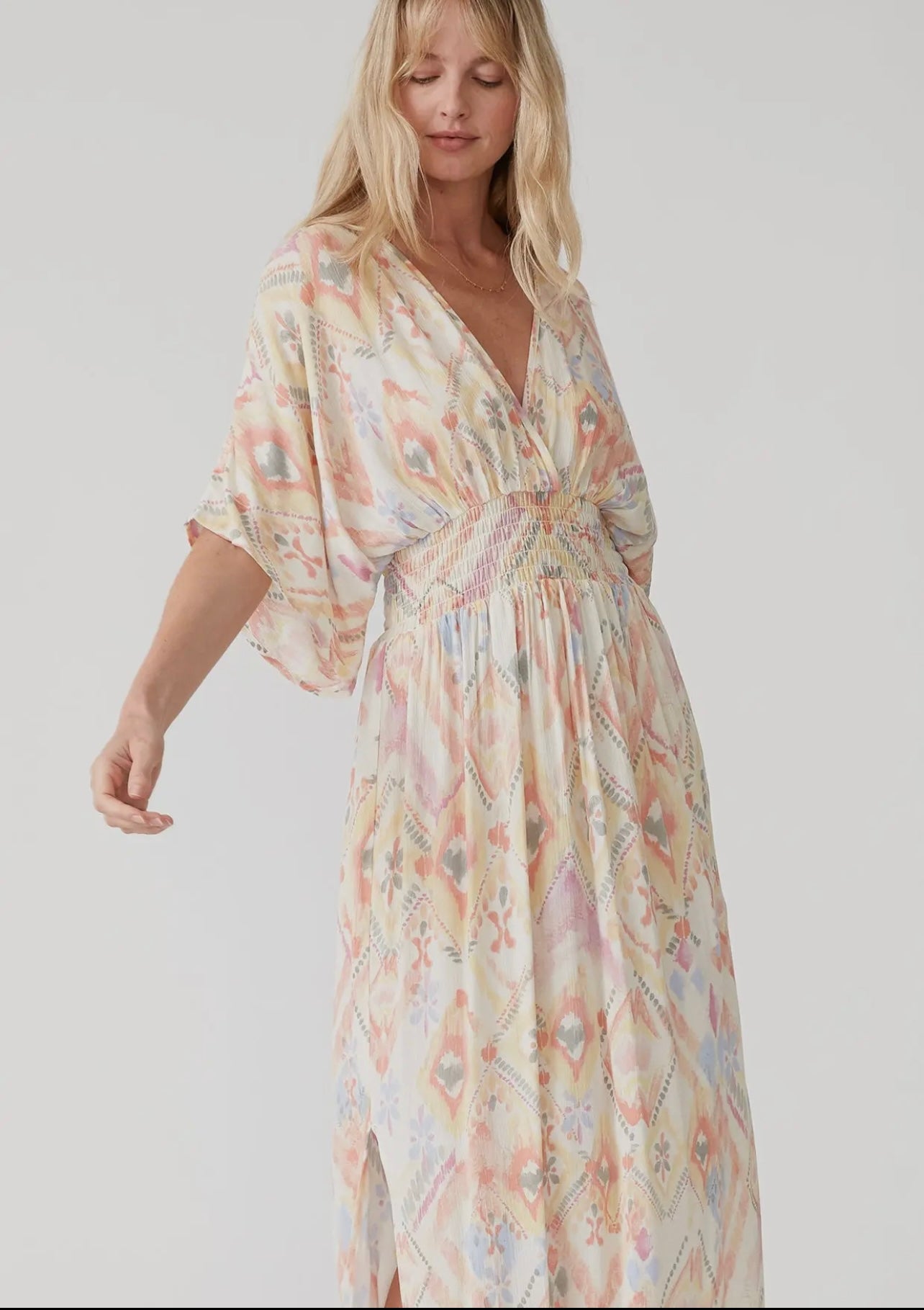 Pastel colored maxi dress with a bat wing sleeve