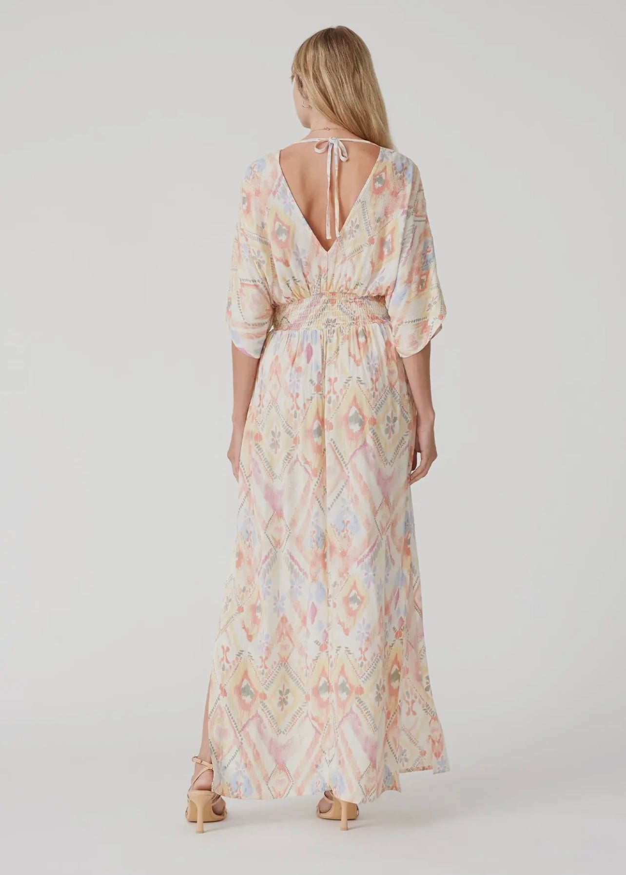 Pastel colored maxi dress with a bat wing sleeve